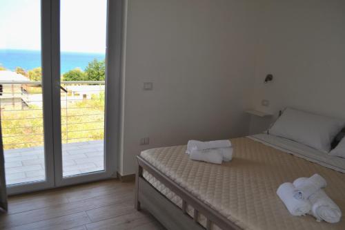 Katil atau katil-katil dalam bilik di Campus Dei - Tropea Rooms