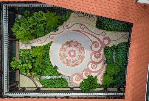 a rendering of a garden on a building at DoubleTree by Hilton Putrajaya Lakeside in Putrajaya