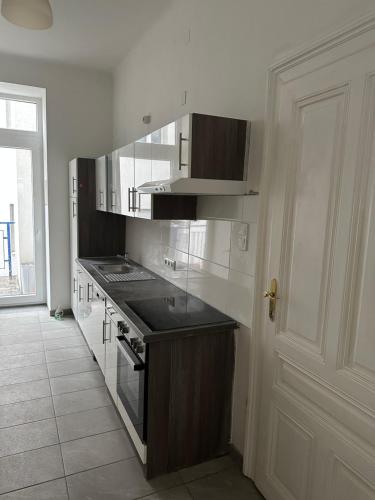 a kitchen with a sink and a stove top oven at City Apartment in Vienna