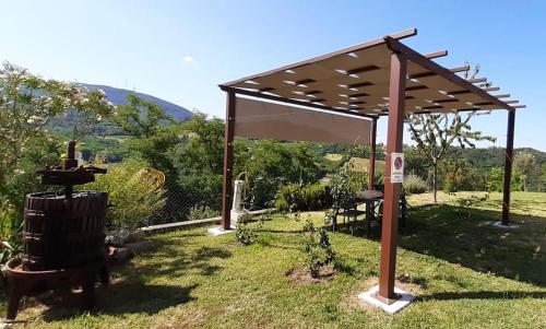 a pergola in a yard with a fire hydrant at Ca' Tobia in Teolo