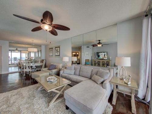 a living room with a couch and a ceiling fan at Pelican Pointe 1505 by Vacation Homes Collection in Orange Beach