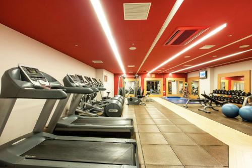 a fitness room with treadmills and exercise machines at Hilton Niseko Village in Niseko