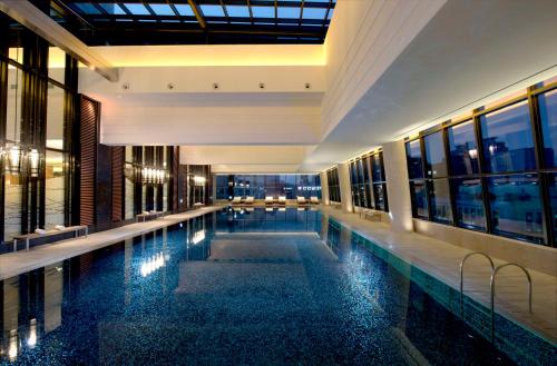 a swimming pool in the middle of a building at Conrad Seoul in Seoul