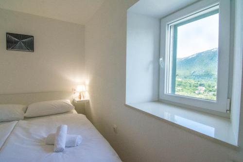 Postel nebo postele na pokoji v ubytování Stone house with pool Ljubica