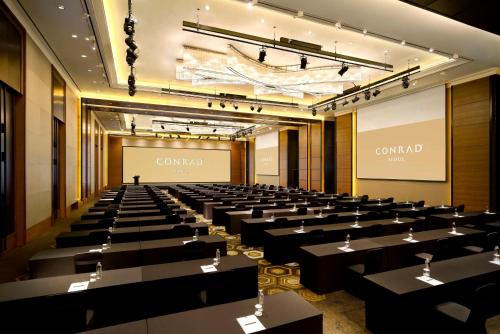 a large conference room with tables and chairs at Conrad Seoul in Seoul