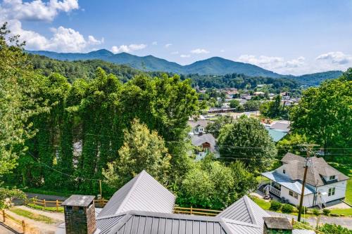 an aerial view of a town with mountains in the background at STEPS TO BRYSON - MTN VIEWS, HOT TUB, FIREPIT, WALK TO TOWN! in Bryson City