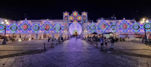 a building decorated with christmas lights at night at Villa Rosetta - Casa Vacanze in Palmi