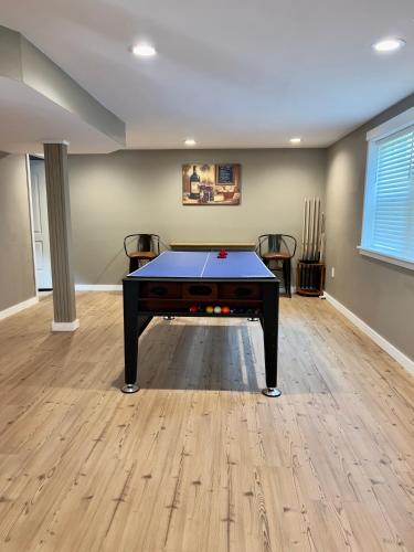 a room with a ping pong table in it at Riverfront House in Harpers Ferry in Harpers Ferry