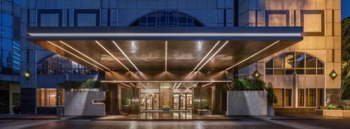 a rendering of a hotel entrance with a building at Conrad Bangkok in Bangkok