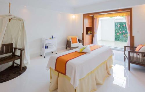 a bedroom with a large bed and a window at Hilton Guam Resort & Spa in Tumon