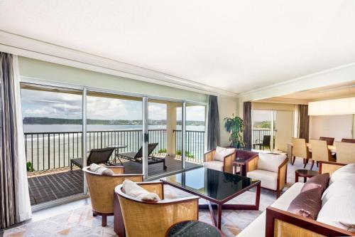 a living room with a view of the ocean at Hilton Guam Resort & Spa in Tumon