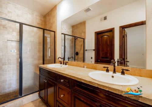 a bathroom with two sinks and a shower at San Felipe Beach Rental Condo 71-2 in San Felipe