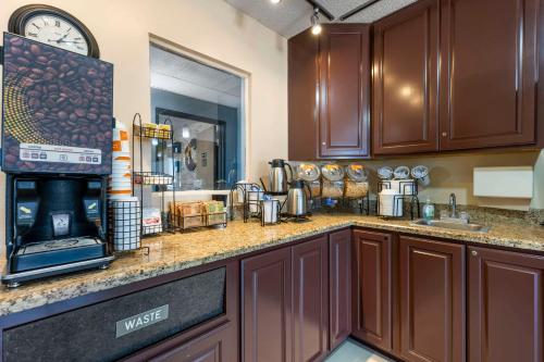 a kitchen with a counter top with a stove at Comfort Inn Hastings in Hastings