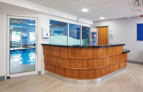 a bar in a waiting room with a pool at DoubleTree by Hilton Bristol North in Bristol