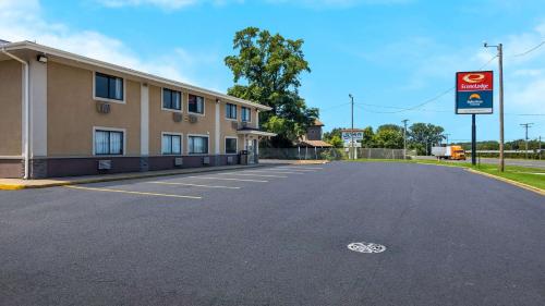an empty parking lot in front of a hotel at Suburban Studios Portage in Portage