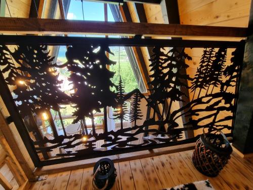 a window in a room with a plant at Eka's Village in Plav