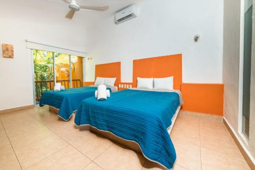 Postel nebo postele na pokoji v ubytování Hotel Ixzi Plus