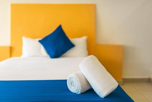 Postel nebo postele na pokoji v ubytování Hotel Ixzi Plus