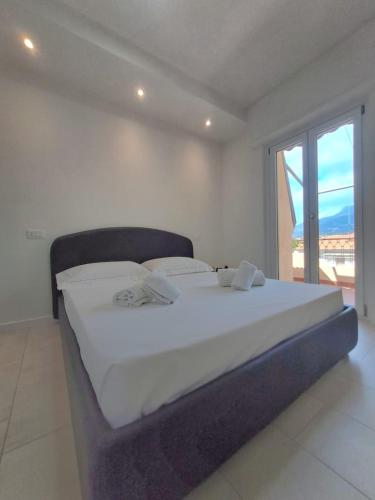 Ένα ή περισσότερα κρεβάτια σε δωμάτιο στο Attico Sweet Dreams