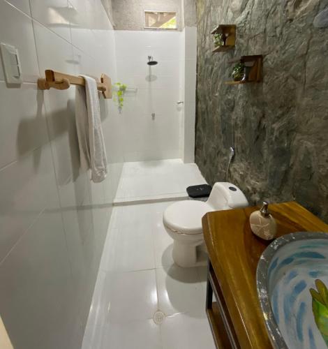 a bathroom with a toilet and a shower and a sink at Casa Playa Puerto luz in Santa Marta