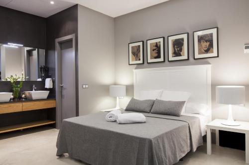 Katil atau katil-katil dalam bilik di Kare No Apartments by Sitges Group