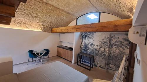 a room with a table and a fireplace in a house at CAIETA Housing in Gaeta