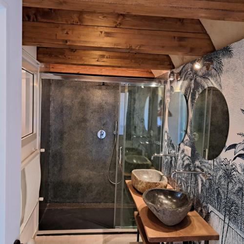 a bathroom with two sinks and a shower at CAIETA Housing in Gaeta