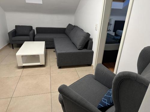 a living room with two couches and a table at Best Cologne in Cologne