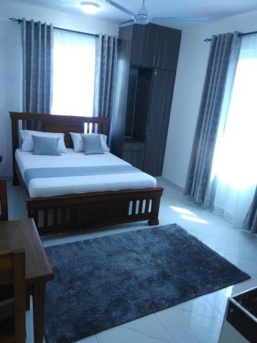 Grey Pearl Apartments Where Raha is Also Our Priorityにあるベッド