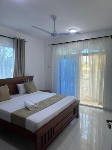 Grey Pearl Apartments Where Raha is Also Our Priorityにあるベッド