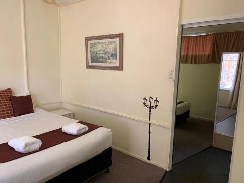 Postel nebo postele na pokoji v ubytování Arkana Motel