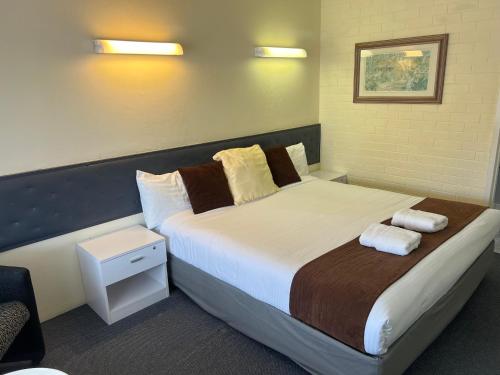 Postel nebo postele na pokoji v ubytování Arkana Motel