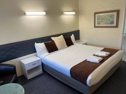 Postel nebo postele na pokoji v ubytování Arkana Motel