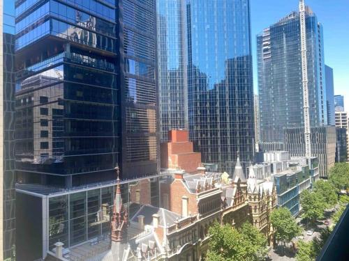 a view of a city with many tall buildings at So Unique! Collins Street Vibe 2B2B in Melbourne