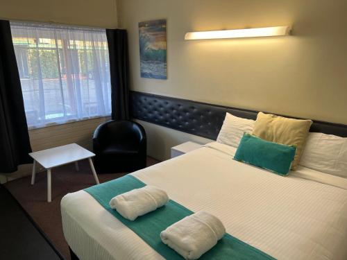 Postel nebo postele na pokoji v ubytování Arkana Motel