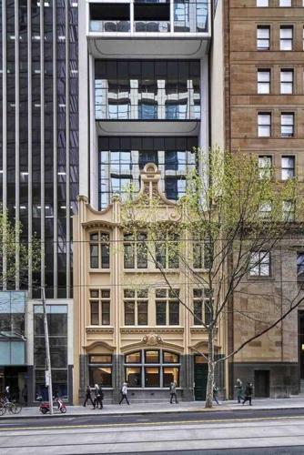 a tall building with people walking in front of it at So Unique! Collins Street Vibe 2B2B in Melbourne