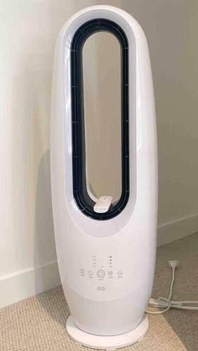 a white and black hair dryer sitting on the floor at So Unique! Collins Street Vibe 2B2B in Melbourne