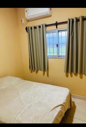 Ein Bett oder Betten in einem Zimmer der Unterkunft La escondida