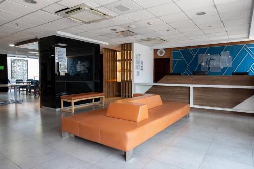 a waiting room with a couch and a table at Holiday Inn Express Mexico City Satelite by IHG in Mexico City