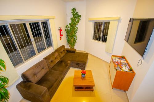a living room with a couch and a coffee table at Hotel Penha in Penha