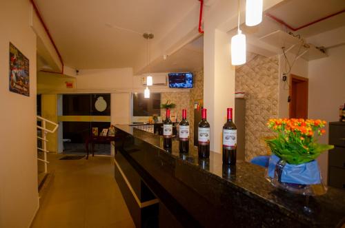 a bar with bottles of wine on a counter at Hotel Penha in Penha