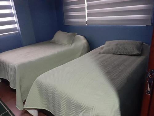 Tempat tidur dalam kamar di Casa vacacional urkupiña