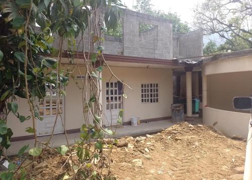 a house being built with a pile of dirt at Departamentos el amigo 