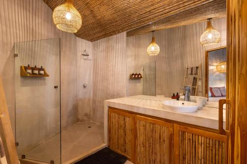 a bathroom with a sink and a shower at Norte Nosara - Steps to Playa Guiones in Nosara