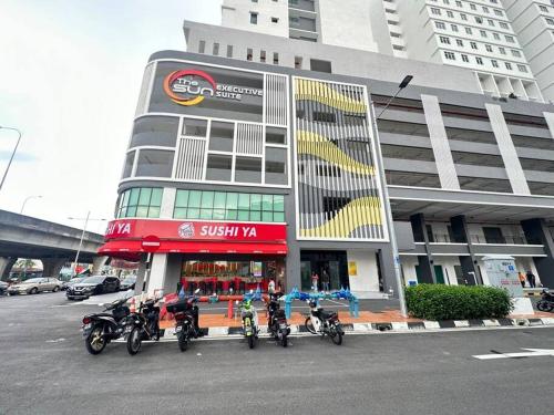 a group of motorcycles parked in front of a building at TheSun #3BR #PISA #FTZ #FamilyStay #USM in Bayan Lepas