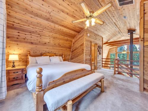 a bedroom with a bed and a ceiling fan at Moonlight Ridge in Duck Creek Village