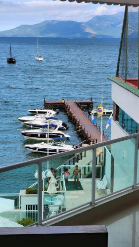 a view of a dock with boats in the water at Angra inn, Angra dos Reis in Angra dos Reis