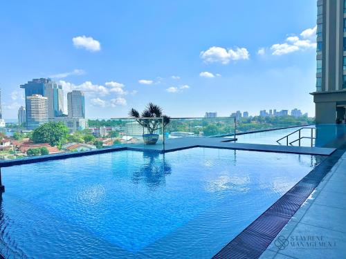 a large swimming pool on top of a building at SKS Pavillion Residences by Stayrene in Johor Bahru