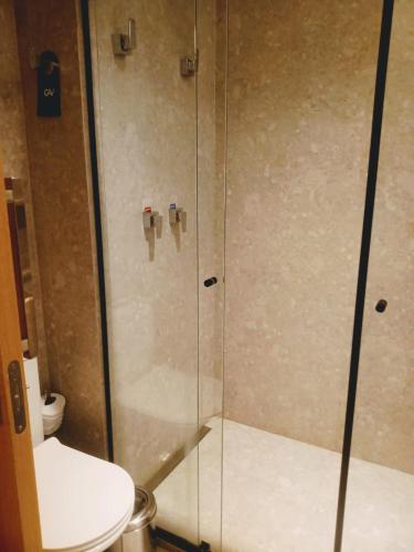 a bathroom with a shower with a toilet at Salinas Premium Resort in Salinópolis