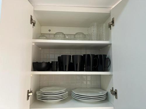 Η κουζίνα ή μικρή κουζίνα στο Aconchegante Pitangueiras - Ap. 1312